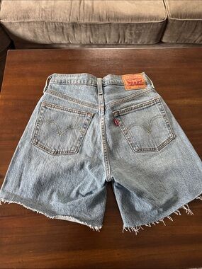 Levi's Women's 501 high-Rise Denim Cutoff mid thigh Shorts. 25
